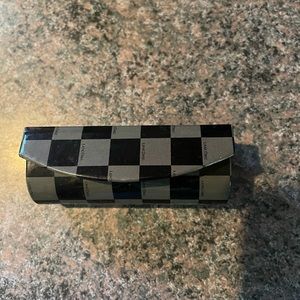 Grey and black checkered lipstick case